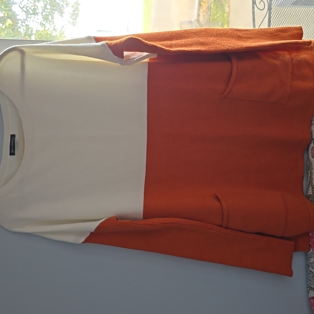 Elegant Two-Tone Orange and Cream Sweater